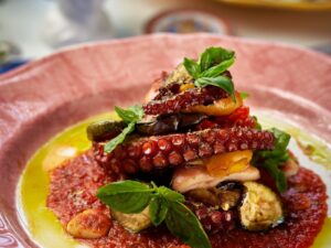 Charcoal grilled octopus on Sicilian tomato sauce with basil at Mandorla, Chiang Mai
