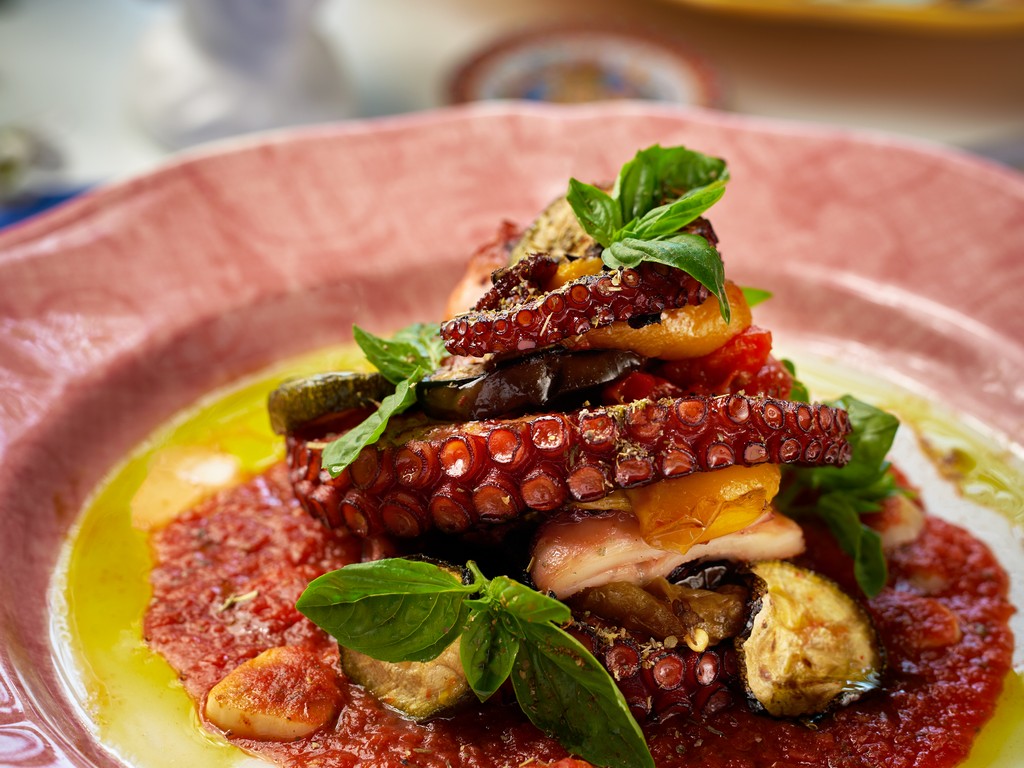 Charcoal grilled octopus on Sicilian tomato sauce with basil at Mandorla, Chiang Mai